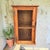 Mid century natural wood (no finish) knotty pine cabinet. One door with wire panel. Interior has two shelves. Measures...