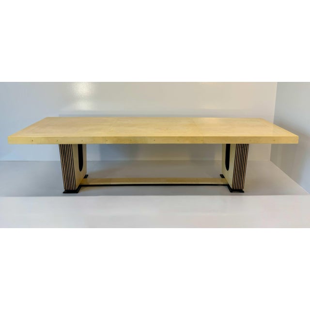 Striking Italian Art Deco table dating from the 1940s, featuring a sophisticated combination of parchment, maple, glossy...
