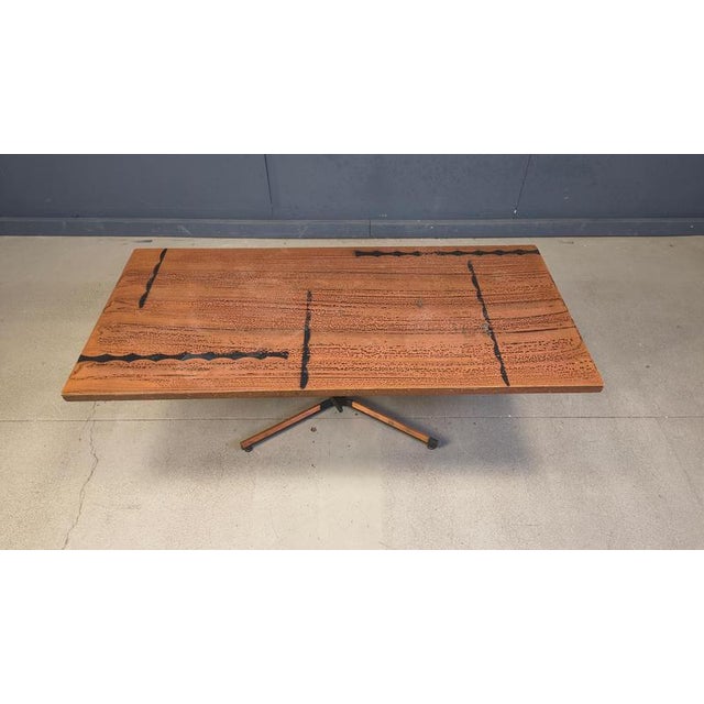 Mid century copper plated coffee table with a modernist design in the style of Bernhard Rohne. Black lacquered and copper...