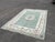Green & White Rug, 9x 6 Feet. Handmade with 100 % Wool. Deep Pile. Has signs of use some little stains, but no rips, a...