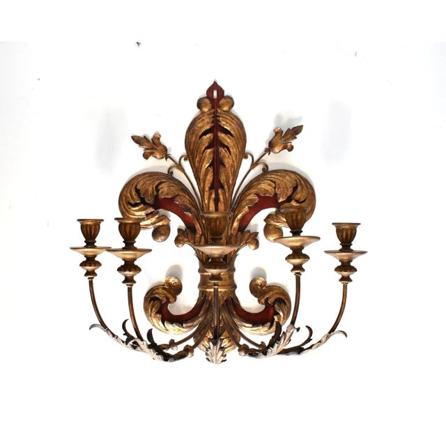 An antique, Italian 5-arm wall sconce or candelabrum in gold gilt and red tole metal with foliate branch details, probably...