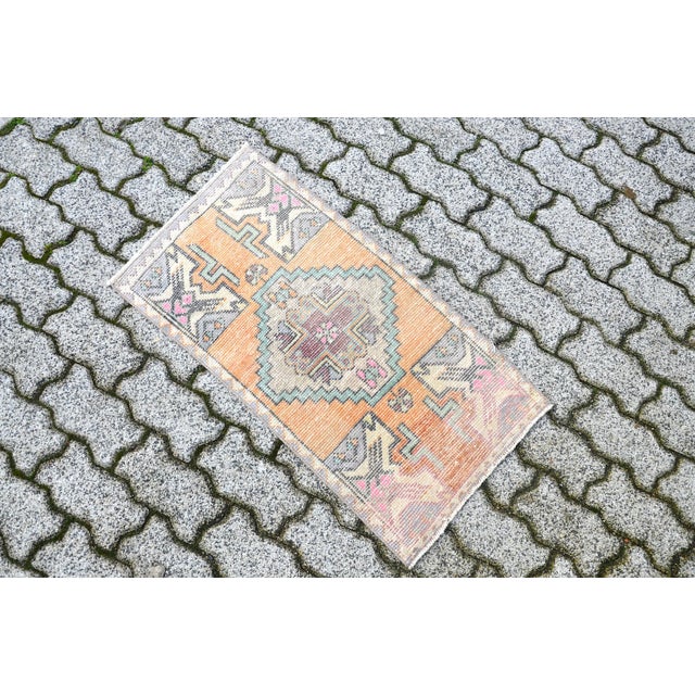 This is a vintage Turkish Oushak rug from the 1960s. The piece was hand-knotted.