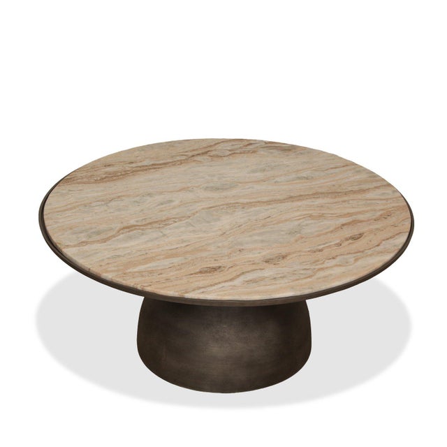 The Four Hands Corbett Coffee Table merges contemporary elegance with rustic appeal, showcasing a bold design that makes...