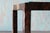 A 1960s mixed metal table with thick inset chiseled slate top. Signature Paul Evans style. . The bottom of the slate hand...