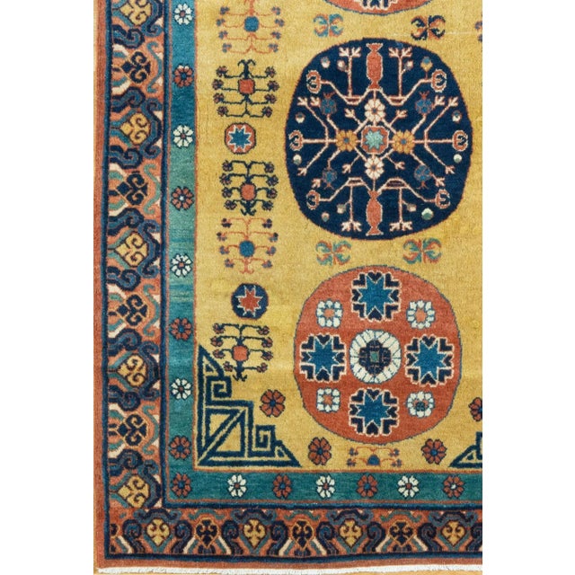 The old gold field of this uncommon and very highly attractive Khotan scatter piece displays the classic 3 "moon"...