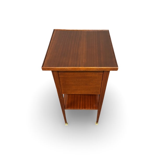 Original Art Nouveau side table with three drawers and a shelf, made around 1910 from mahogany wood. Original brass...