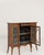 Here is a display cabinet, its dark mahogany with inlay, glass doors open the first thing to catch the eye. Originating in...