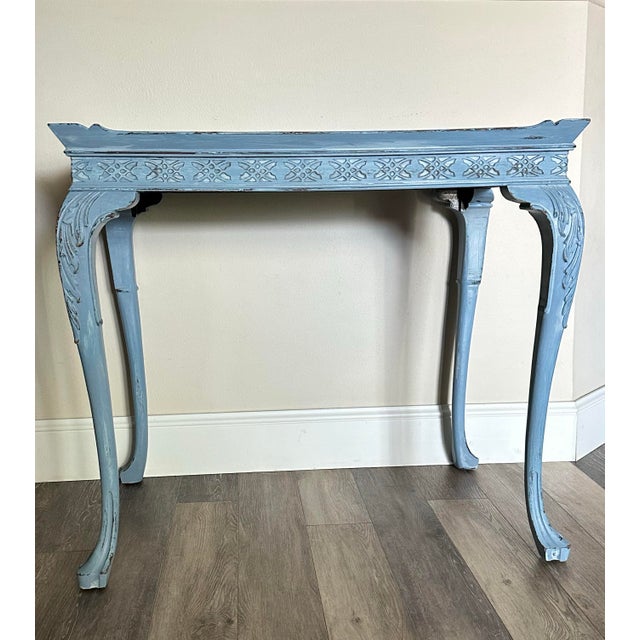 Antique carved walnut tea table. Scroll/floral carvings and cabriole legs with raised molding trim. Blue in color. Rustic...