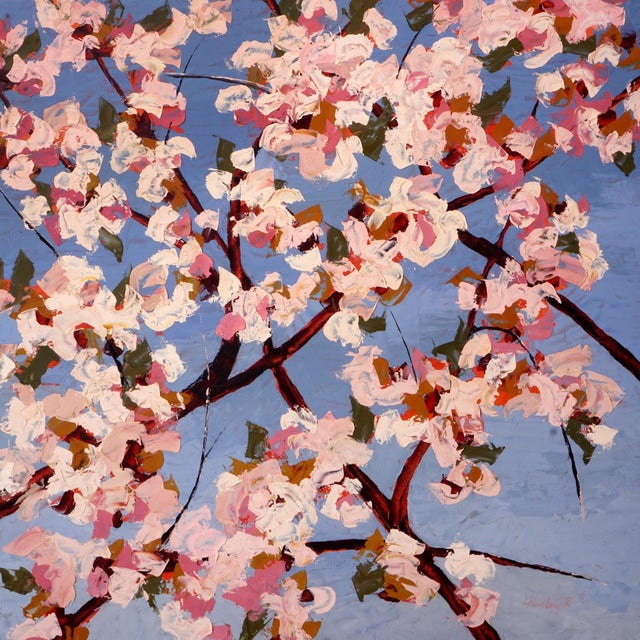 This artwork depicts a vibrant explosion of blossoms against a serene blue background, capturing the fleeting beauty of...