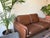 De Sede Ds-61 two-seat sofa, manufactured in Switzerland, in the 1960s. A masterpiece of function and style — the sofa is...