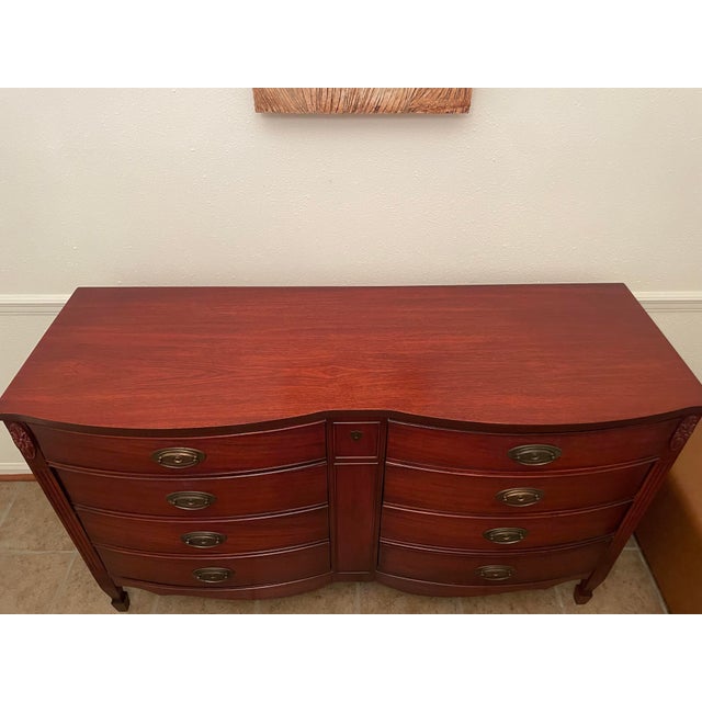 Beautiful, timeless midcentury (circa 1940s/1950s) gorgeous rich mahogany curved bowfront double dresser manufactured by...