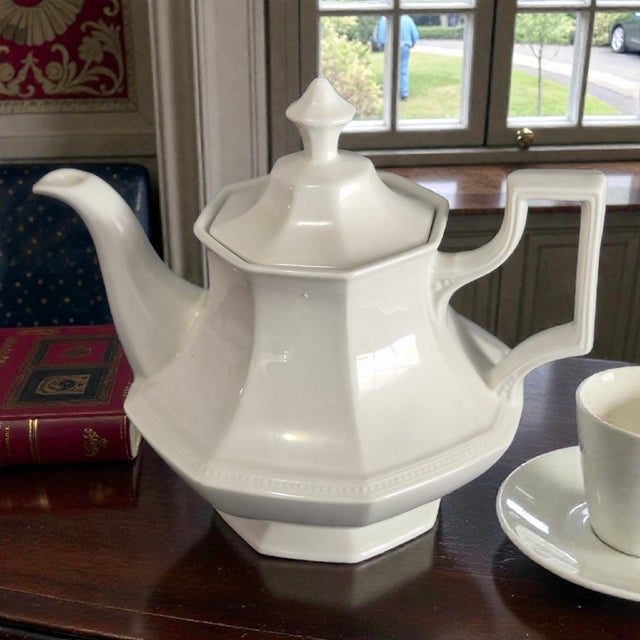 The Vintage Attributed Johnson Brothers Ironstone Classical White Tea Pot is a classic and elegant piece of dinnerware,...