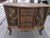 Mid to late 20th century Woven Rattan & Wicker Solid wood frame Hand rubbed finish Hand painted gold tone leaf Overall...