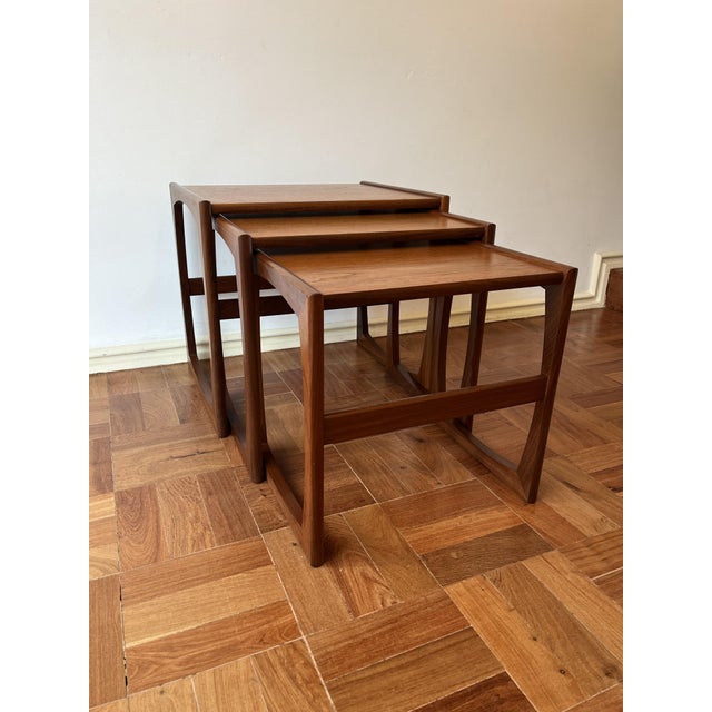 Beautiful set of three teak nesting tables by G-Plan, United Kingdom, 1950s-1960s. Very good condition. The label is still...