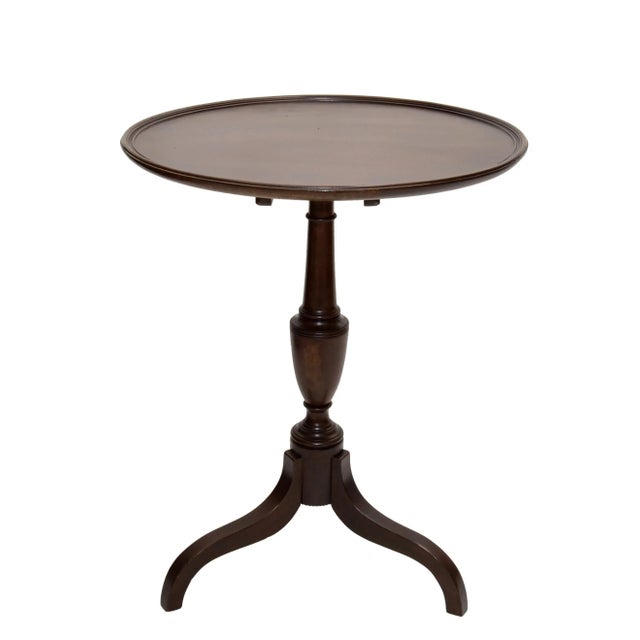 We offer an Victorian Style side table with turned wood pedestal stand made in the 1930s. Has a Flip-Top which is secured...