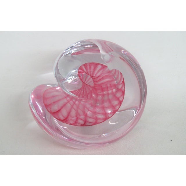 This wonderful Paper Weight is made of art glass. This stunning vintage piece features a vibrant pink swirl patter...
