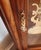 A distinguished Howard Miller “Charlemagne” floor clock (Model 610-361), crafted in richly figured oak and featuring one...