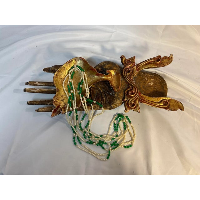 This is a unique decor item. A 15” Asian style wooden carved hand server or display piece.. such a conversation starter....