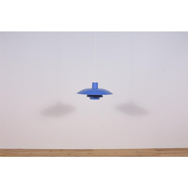 This pendant was designed by Poul Henningsen and produced by Louis Poulsen from 1966 until it was discontinued in this...