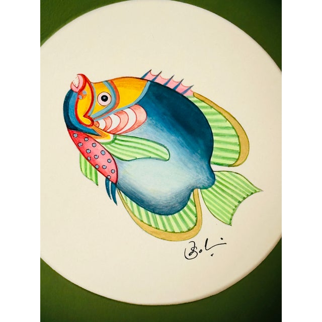 Hand-painted by our master artist using acrylic paints and natural pigments, this little fish is alive with joyful pops of...
