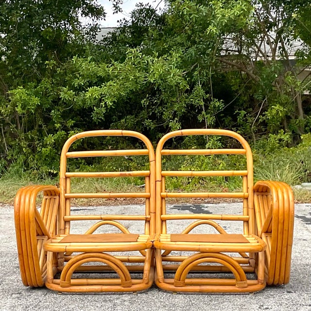 Embrace coastal sophistication with this Vintage Four Strand Bent Rattan Sofa, reminiscent of iconic designs by Frankl....