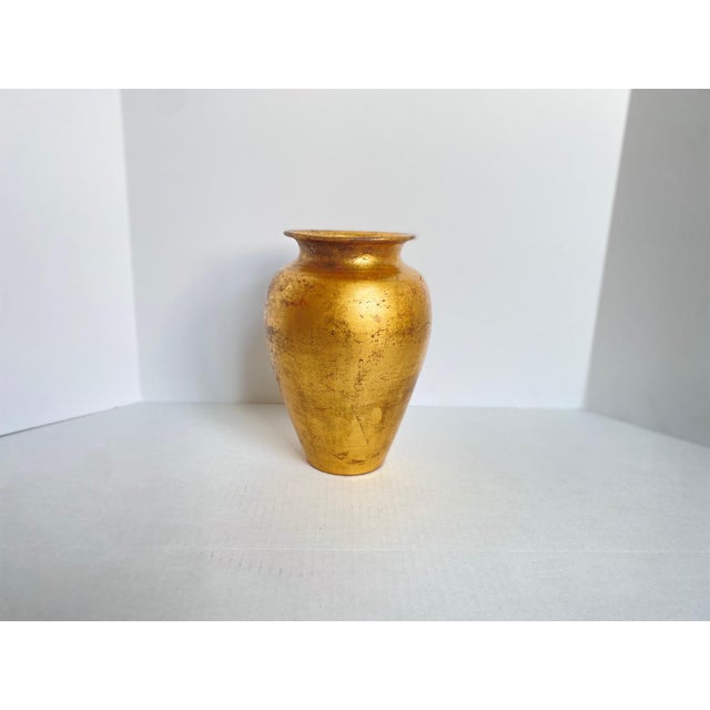 Vintage Italian gold leaf finished terracotta Florentine style vase. It has natural imperfections and shadows and wear...