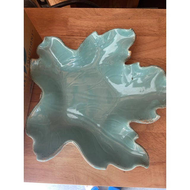 Add a touch of midcentury charm to your space with this vintage leaf-shaped ceramic dish. Featuring a beautifully sculpted...