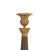 Pair of candlesticks, Empire style, France, circa 1810, gilt and patinated bronze, round base, fluted stem, patina...