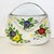 This is so pretty. A metal hand painted tole basket to hang on a wall. The artist painted colorful pansies and leaf...