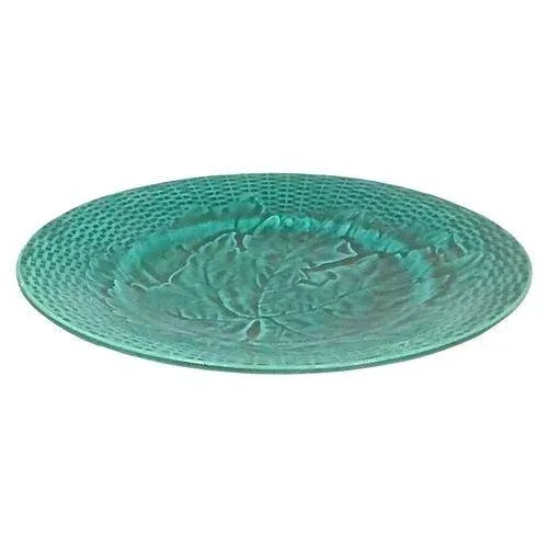 Antique majolica basket weave and maple leaf plate. Marked with a bugle logo on the underside.