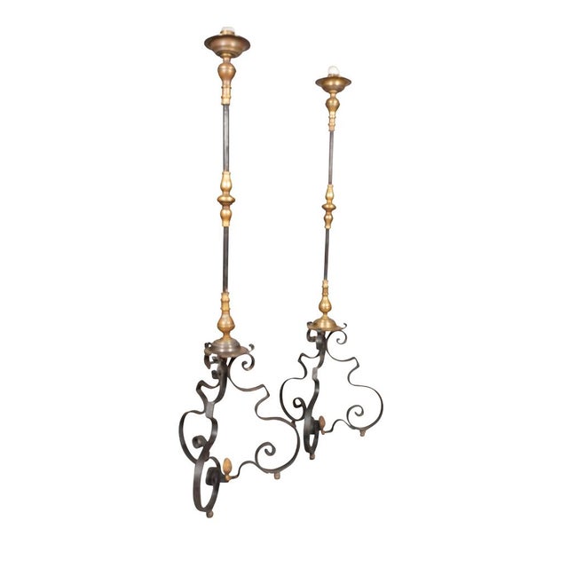 Pair Of Wrought Iron and Bronze Torcheres with candleholder and wide bobeche. Brass and iron with shaped iron tripartite...