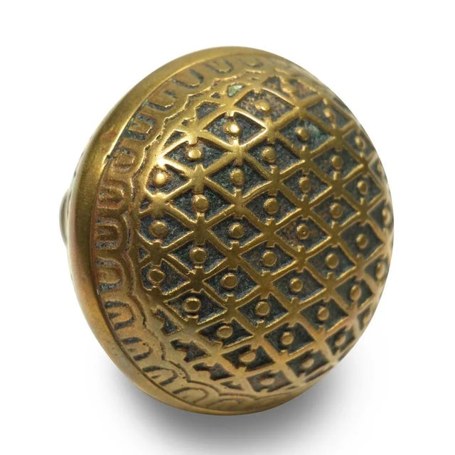 This Vernacular style field pattern bronze doorknob was manufactured by Kenton Lock Co. in the 1892 catalog. It is part of...