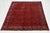 This handmade Turkmen Wool rug had a red field with an allover pattern in blue and orange. This rug measures 9'10'' x...
