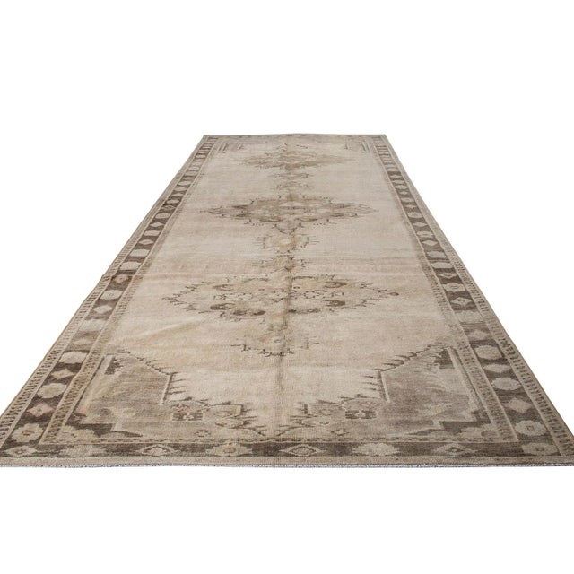 Vintage handknotted decorative wool rug from Kars region of Turkey. Approximately 50-60 years old. In very good condition.