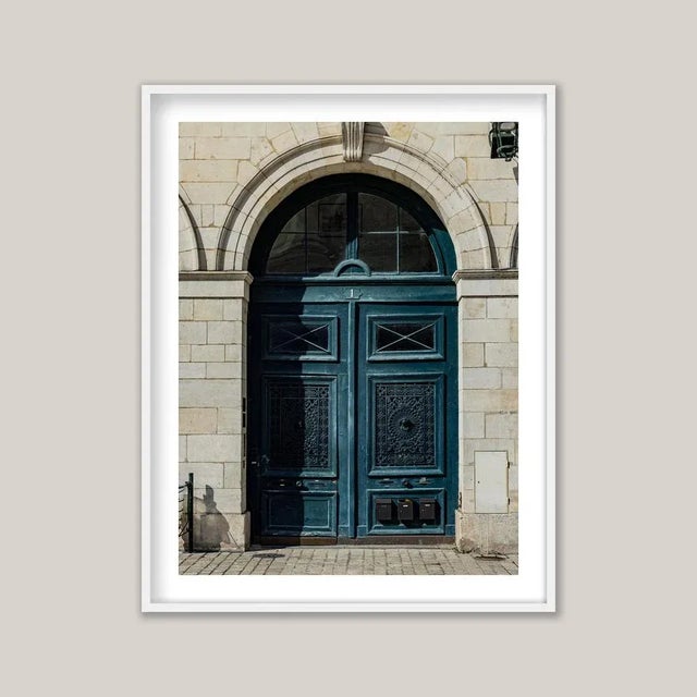 Historic European architecture often reveals its character at street level through tall, double doors - sometimes ornate,...