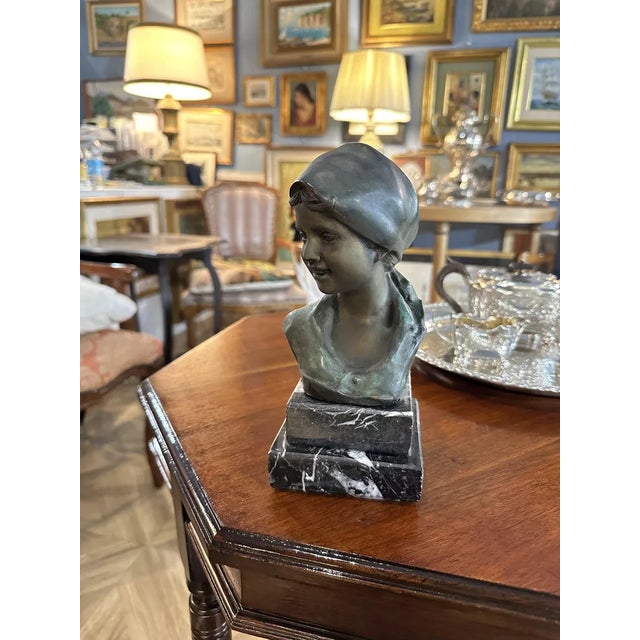 Fine bronze sculpture signed Giovanni De Martino (1870-1935) depicting a smiling peasant girl, two-stepped marble base....