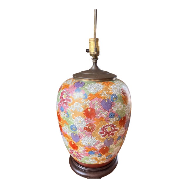 Hand painted table lamp with beautiful floral motif. Mounted on a dark wooden base. Works with unaltered wiring and...
