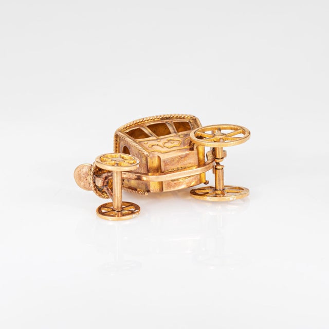 Finely detailed vintage mid century carriage charm crafted in 19k yellow gold (circa 1980s to 1960s). Crafted in...