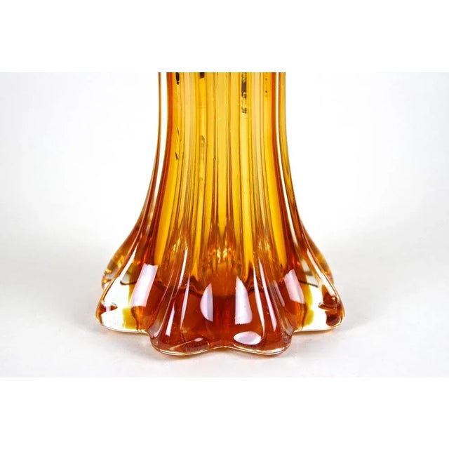 Colorful large mid-century Murano glass vase out of the famous glass art workshop Sommerso in Venetia/ Italy. Artfully...