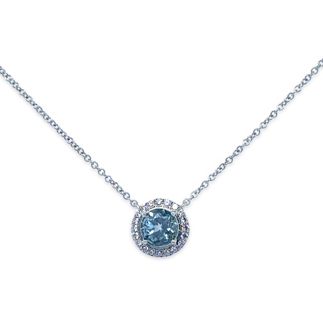 A timeless Tiffany & Co. Soleste pendant necklace crafted in platinum, featuring a vibrant aquamarine centre stone...