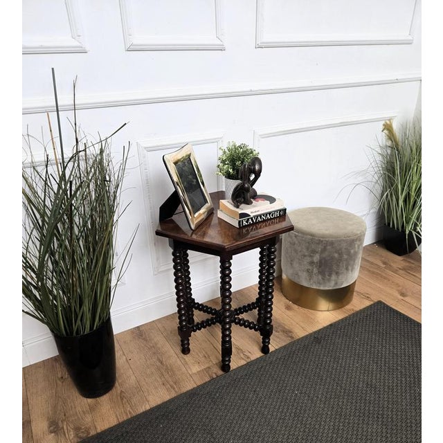 Beautiful antique Italian solid walnut side table, features hexagonal top with beveled edges over six beautifully bobbin...