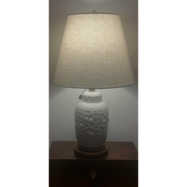 Sweet mid century blanc de chine (reticulated porcelain) bedroom table lamp. Pull the ball chain and the upper bulb lights...