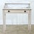 This 19th-century English vanity table features a white marble surface atop a recently painted wooden frame. The vanity...