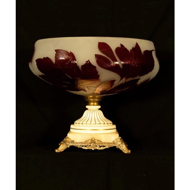 A highly decorative French cameo glass centrepiece, dating to the late 19th or early 20th century and displaying the...