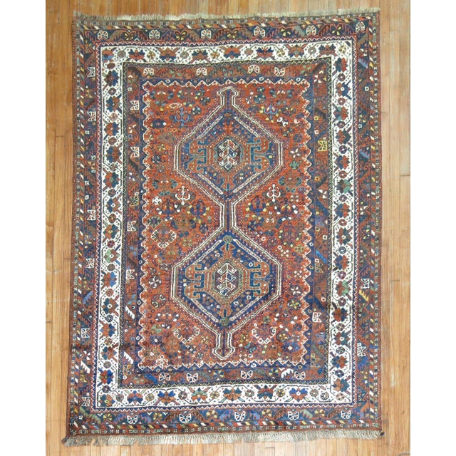 An early 20th century Persian Shiraz small accent square size tribal rug in rustic colors. circa 1930 Measures: 5.10" x 7.1".
