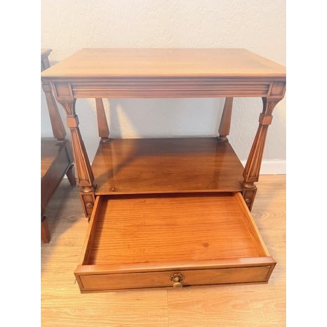 Crafted from richly toned wood and accented with striking brass hardware, these nightstands embody the clean lines and...