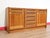 A stunning credenza in the style of renowned Danish furniture maker Dyrlund, this Mid Century Modern Vintage Teak Danish...