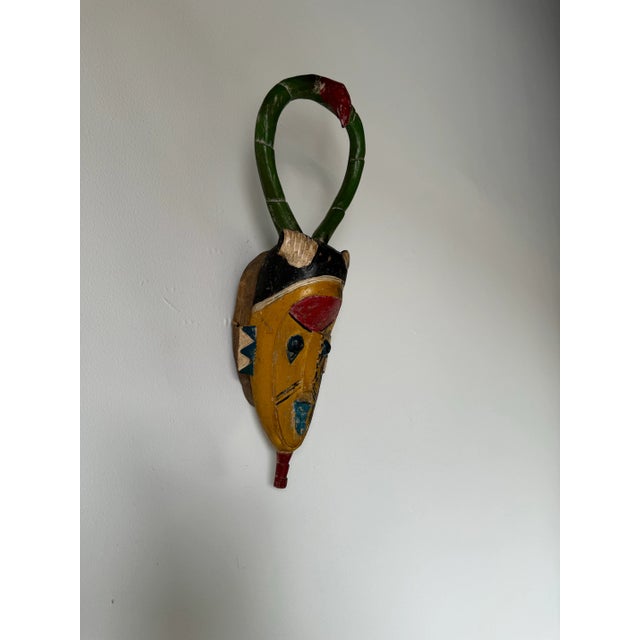 I'm pleased to offer for sale this fantastic Vinatge hand carved and painted Ivory Coast African Tribal Guro Mask....