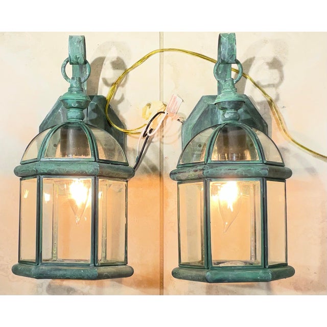 Elevate your entryway, patio, or hallway with this matching pair of small solid brass wall lanterns. Featuring a classic...