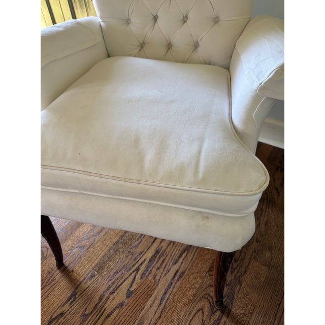 Pair of white cotton upholstered roll arm side chairs. Tufted button backs and down filled cushions. Some spots shown in...